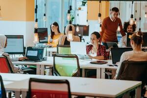 Multiethnic group of employees working in a marketing company. A group of colleagues is working on a project in modern offices photo