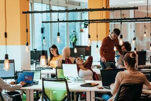 Multiethnic group of employees working in a marketing company. A group of colleagues is working on a project in modern offices photo