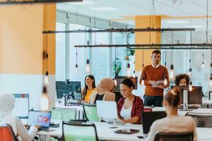 Multiethnic group of employees working in a marketing company. A group of colleagues is working on a project in modern offices photo