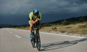 triathlon athlete riding bike photo