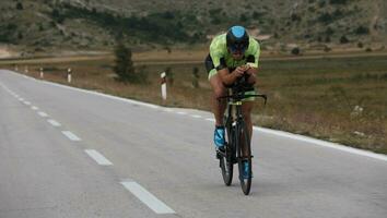 triathlon athlete riding bike photo