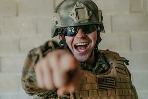 I choose you. A soldier with an outstretched hand towards the camera shows that he chooses you for support and partnership in warfare photo