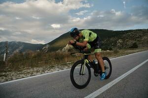 triathlon athlete riding bike photo