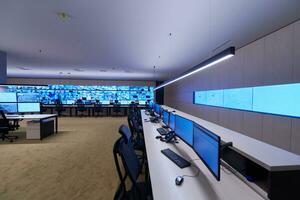 Empty interior of big modern security system control room photo