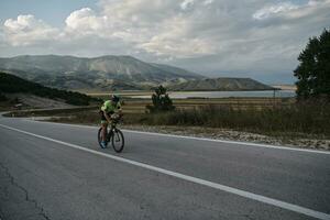 triathlon athlete riding bike photo