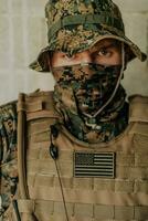 American marine corps special operations soldier preparing tactical and commpunication gear for action battle closeup photo