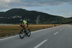 triathlon athlete riding bike photo