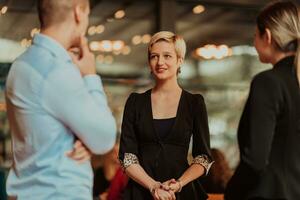 Photo of a business team of young people discussing business ideas in a modern urban environment. Selective focus