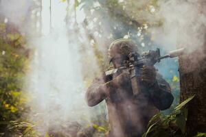 A group of modern warfare soldiers is fighting a war in dangerous remote forest areas. A group of soldiers is fighting on the enemy line with modern weapons. The concept of warfare and military conflicts photo