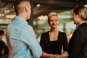 Photo of a business team of young people discussing business ideas in a modern urban environment. Selective focus