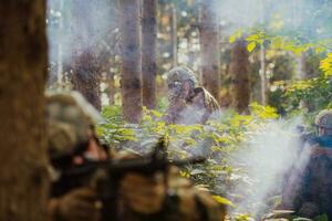 A group of modern warfare soldiers is fighting a war in dangerous remote forest areas. A group of soldiers is fighting on the enemy line with modern weapons. The concept of warfare and military conflicts photo