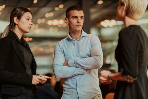 Photo of a business team of young people discussing business ideas in a modern urban environment. Selective focus