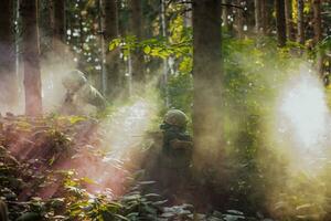 A group of modern warfare soldiers is fighting a war in dangerous remote forest areas. A group of soldiers is fighting on the enemy line with modern weapons. The concept of warfare and military conflicts photo