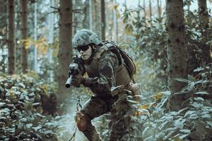 A modern warfare soldier on war duty in dense and dangerous forest areas. Dangerous military rescue operations photo