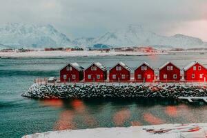 Traditional Norwegian fisherman's cabins and boats photo