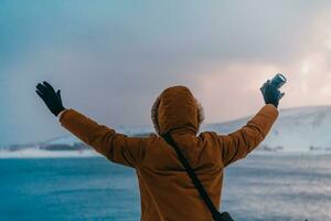 A photographer in the cold Skavdinava regions tries to take a photo for journalism in a strong winter storm