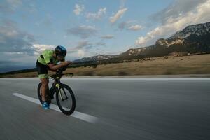 triathlon athlete riding bike photo