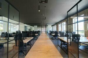 In a setting of modern, glass-walled business startup offices, the open, airy workspace reflects a contemporary and innovative ambiance, promising a dynamic environment for entrepreneurial growth photo