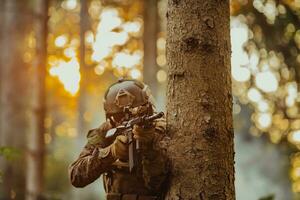 A modern warfare soldier on war duty in dense and dangerous forest areas. Dangerous military rescue operations photo