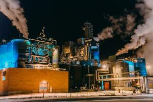 Night photograph of the largest paper production industry in Scandinavia photo