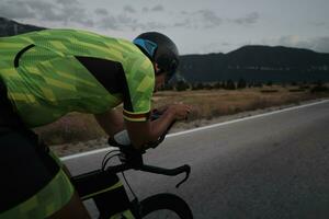 triathlon athlete riding bike photo