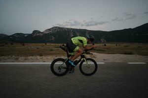 triathlon athlete riding bike photo