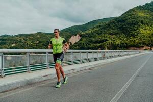 An athlete running a marathon and preparing for his competition. Photo of a marathon runner running in an urban environment