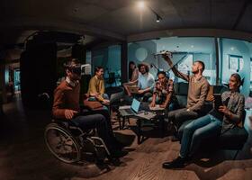 Business persons with a disability at work in modern open space coworking office on team meeting using virtual reality goggles. photo