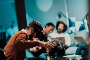 Business persons with a disability at work in modern open space coworking office on team meeting using virtual reality goggles. photo