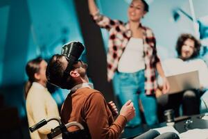 Business persons with a disability at work in modern open space coworking office on team meeting using virtual reality goggles. photo