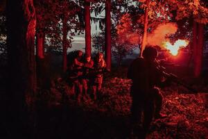 Soldiers team in action on night mission militery concept photo