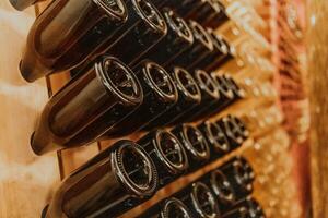 Wine or cognac barrels in the cellar of the winery, Wooden wine barrels in perspective. Wine vaults.Vintage oak barrels of craft beer or brandy. photo