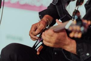 Practicing in playing guitar. Handsome young men playing guitar photo