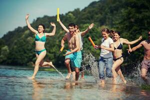 summer joy friends having fun on river photo