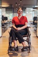 A modern young businesswoman in a wheelchair is surrounded by an inclusive workspace with glass-walled offices, embodying determination and innovation in the business world photo