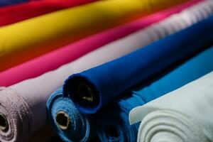 Interior of an industrial warehouse with fabric rolls samples. Small business textile colorful warehouse. photo