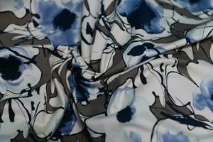 Collection of fashionable fabrics. Samples of different natural fabrics for sewing a fashion collection of clothes. Large selection of fabrics in the store or tailor warehouse. photo