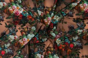 Collection of fashionable fabrics. Samples of different natural fabrics for sewing a fashion collection of clothes. Large selection of fabrics in the store or tailor warehouse. photo