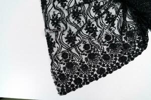 Collection of fashionable fabrics. Samples of different natural fabrics for sewing a fashion collection of clothes. Large selection of fabrics in the store or tailor warehouse. photo