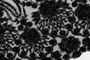 Collection of fashionable fabrics. Samples of different natural fabrics for sewing a fashion collection of clothes. Large selection of fabrics in the store or tailor warehouse. photo