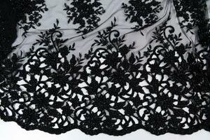 Collection of fashionable fabrics. Samples of different natural fabrics for sewing a fashion collection of clothes. Large selection of fabrics in the store or tailor warehouse. photo