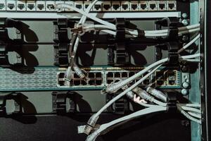 Close up of technician setting up network in server room photo