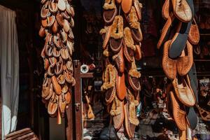 Macedonian folklore, brown sandals. Old shoes. Part of the tradition. Black pants, close up photo