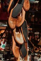 Macedonian folklore, brown sandals. Old shoes. Part of the tradition. Black pants, close up photo