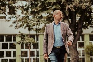 focused businessman in suit walking in urban environment. photo