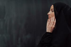 Portrait of young Muslim woman making dua photo