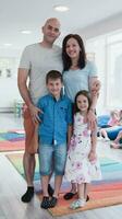 Portrait of a happy family. Photo of parents with children in a modern preschool classroom. Selective focus
