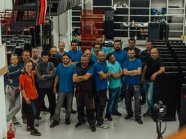 Portrait of Groups diversity workers factory or engineering standing cross arms look confident in an industrial manufacturing factory, Working together, Coordination and Teamwork concept. photo