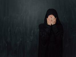 Portrait of young Muslim woman making dua photo