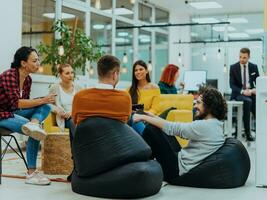 Multiethnic group of employees working in a marketing company. A group of colleagues is working on a project in modern offices photo